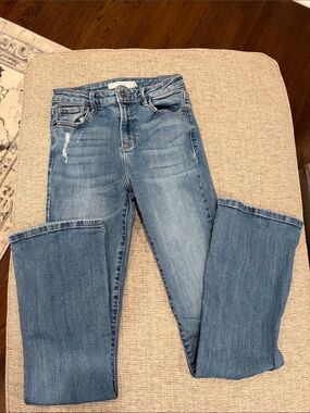 Hidden Blue Boot-Cut Jeans with Subtle Distress